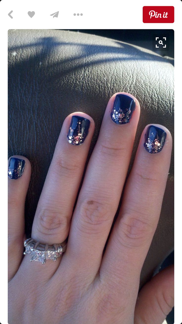 Elegant Navy Blue and Rose Gold Nail Design with Glitter Accents for Versatile Occasions.