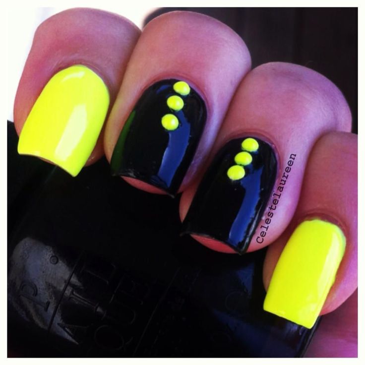 Vibrant Neon Yellow and Glossy Black Nail Design with Playful Dots for a Bold Statement.