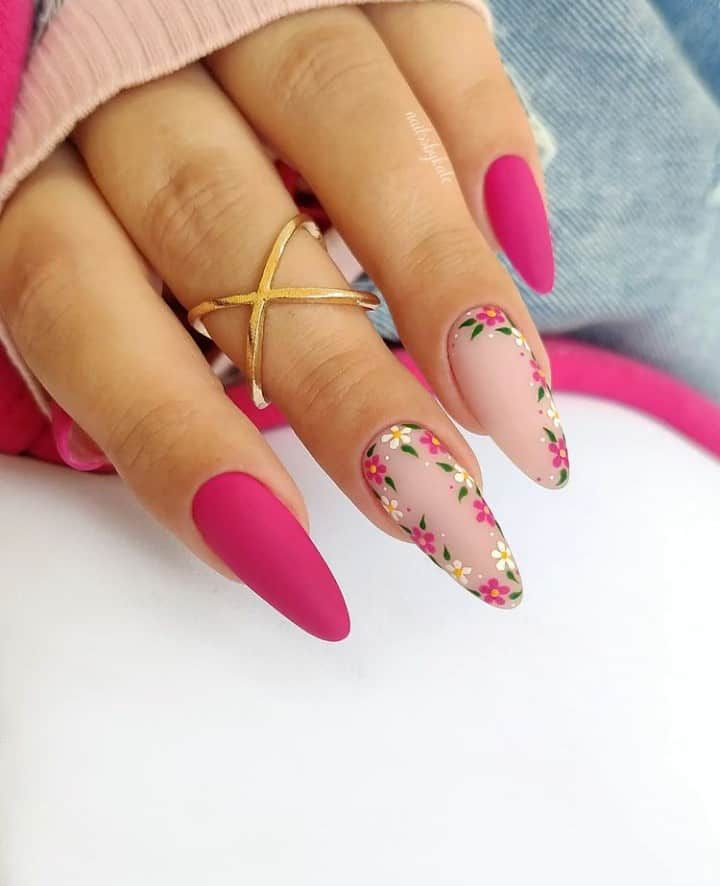 Elegant Matte Fuchsia and Soft Nude Nail Design with Floral Accents and Gold Ring