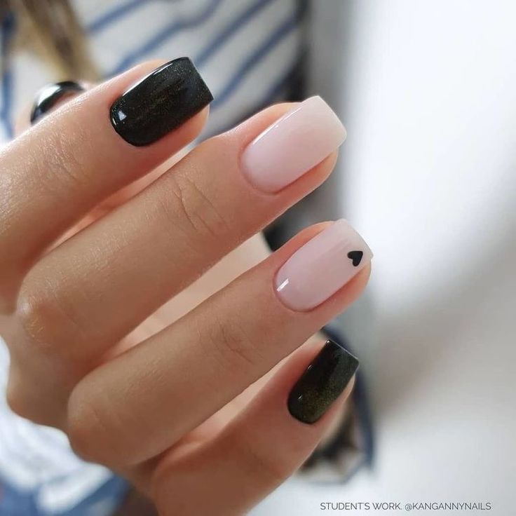 Chic Nail Design: Glossy Black Meets Pastel with Playful Heart Detail.