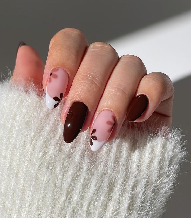 Elegant Chic Nail Design with Warm Shades and Floral Accents.