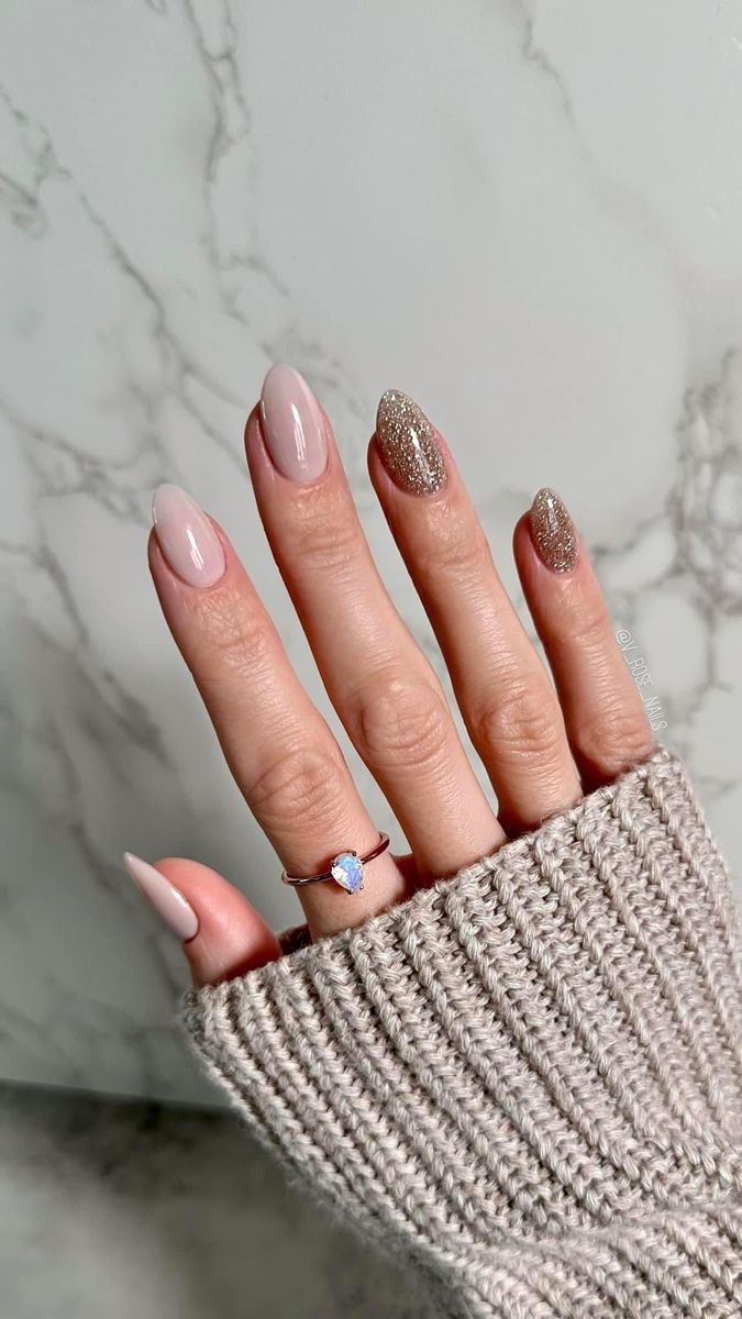 Chic and Elegant Nude and Gold Nail Design with Dainty Ring Accents