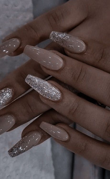 Sophisticated Nude Nail Design with Glamorous Glitter Accents