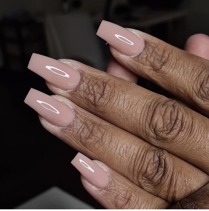 Elegant Glossy Nude Square Nails with White Accents for Any Occasion.