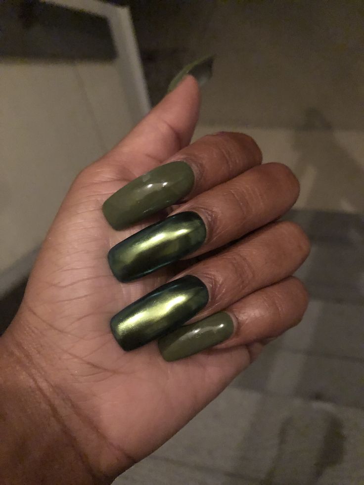 Elegant Two-Tone Deep Green Nail Design: A Bold and Sophisticated Statement.