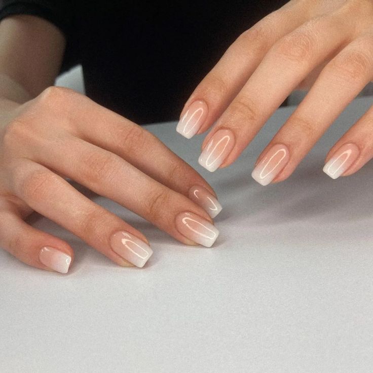 Sophisticated Ombre Nails: Pale Pink to Crisp White Gradient with Glossy Finish