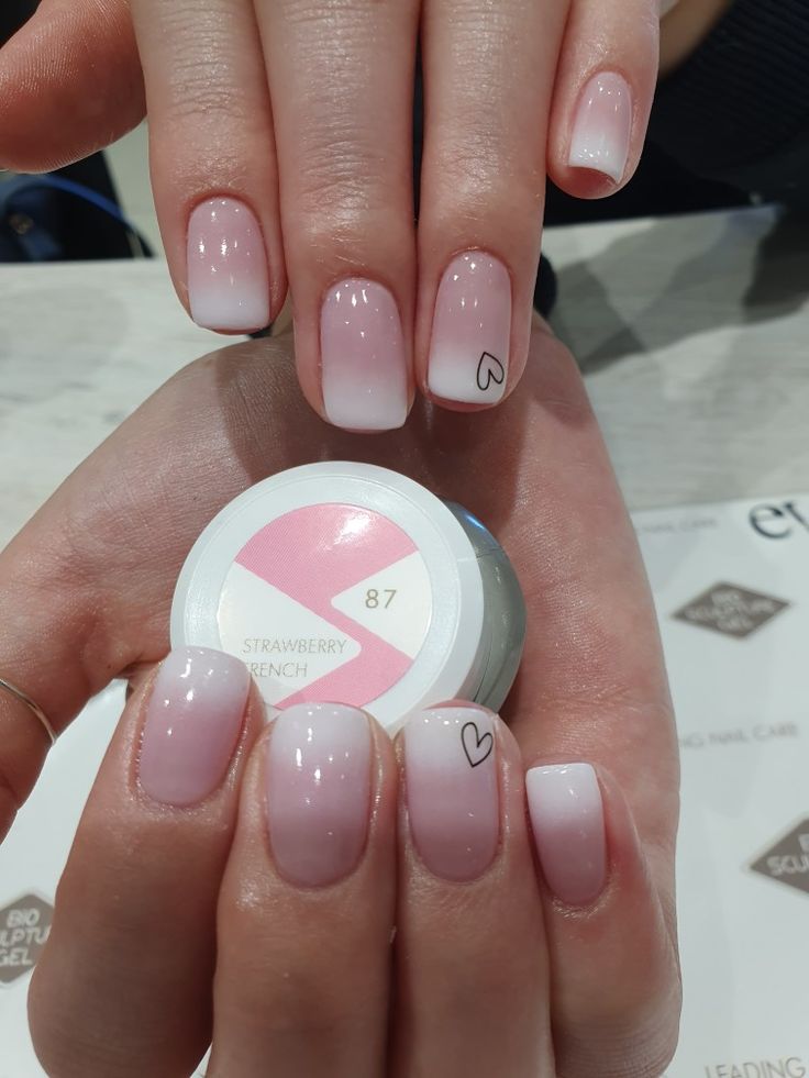 Chic Ombre Nails with Soft Pink Gradient and Playful Heart Accents