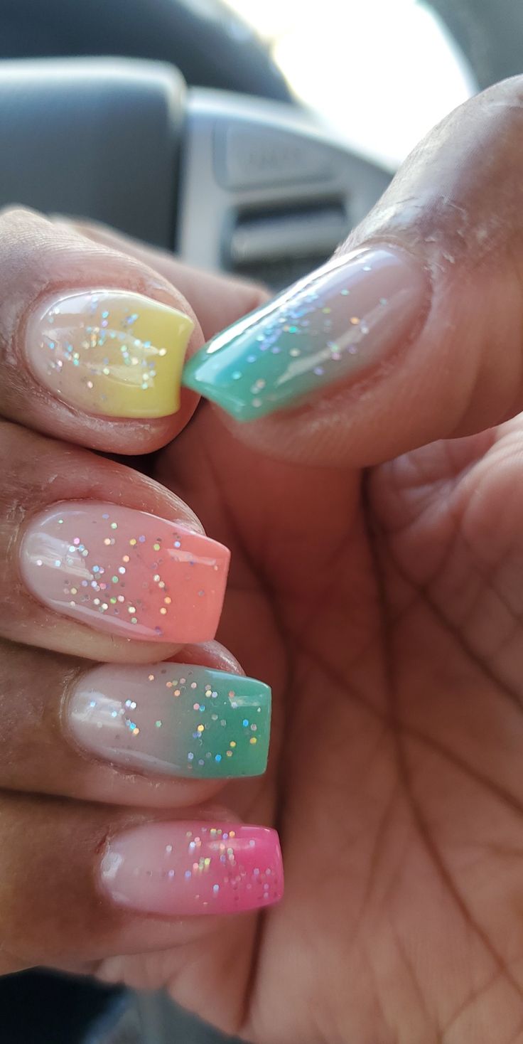 Vibrant Ombre Nails: Playful Summer Design with Glittering Gradient from Yellow to Pink