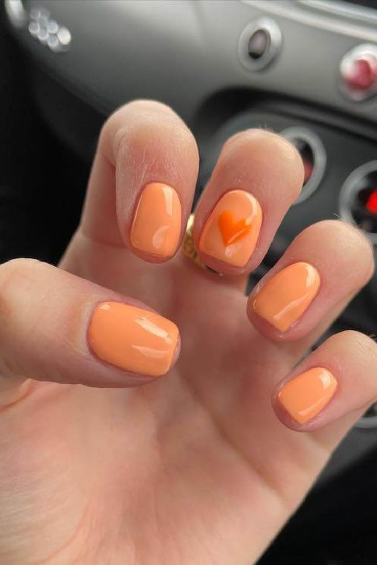 Orange Nails With Heart Design