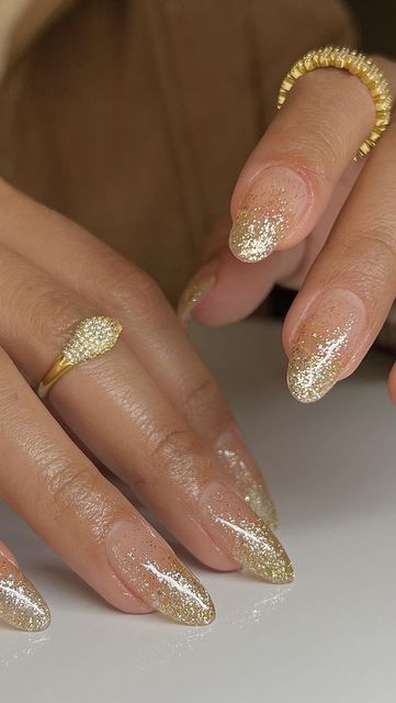 Stunning Glittering Gold Nail Design: A Glamorous Gradient for Elegance and Sophistication.