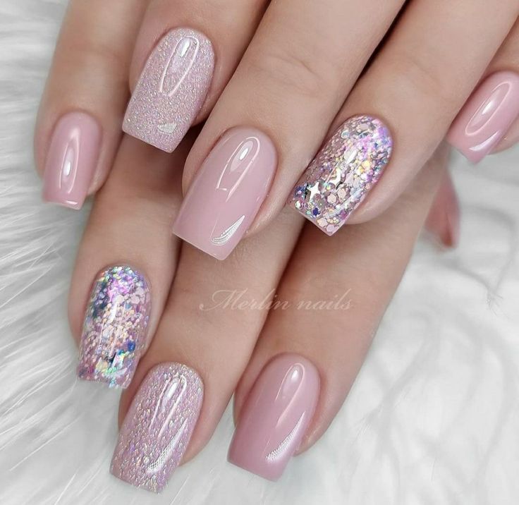 Elegant Nail Design in Blush Pink with Shimmering Glitter and Chic Textures.