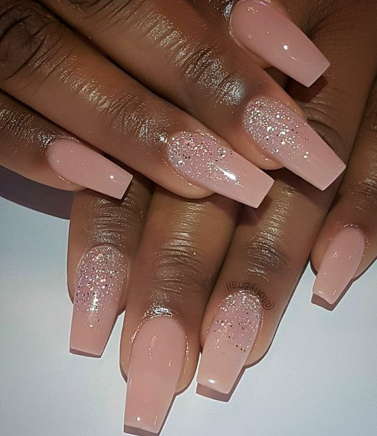 Sophisticated Elegant Nude Nail Design with Glossy Finish and Subtle Glitter Accents.