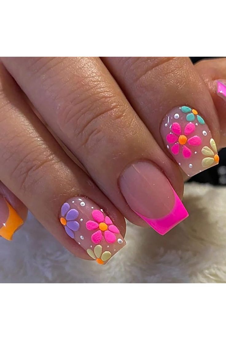 Vibrant Floral Nail Art with Bold Neon French Tips for a Cheerful Summer Look