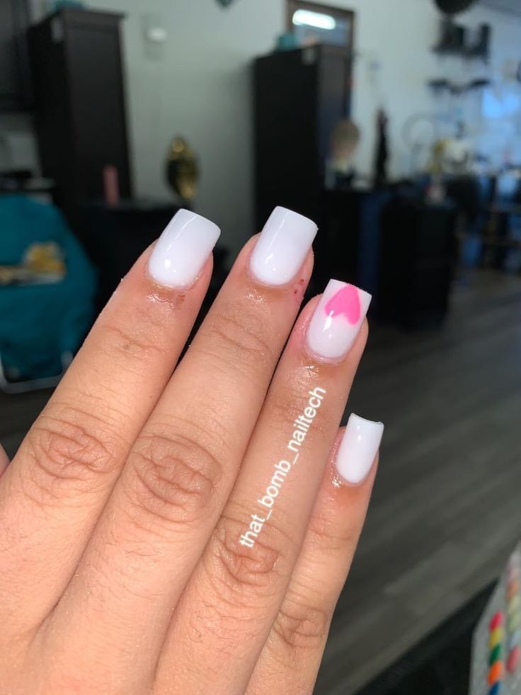 Chic Glossy White Acrylic Nails with Playful Pink Heart Accent