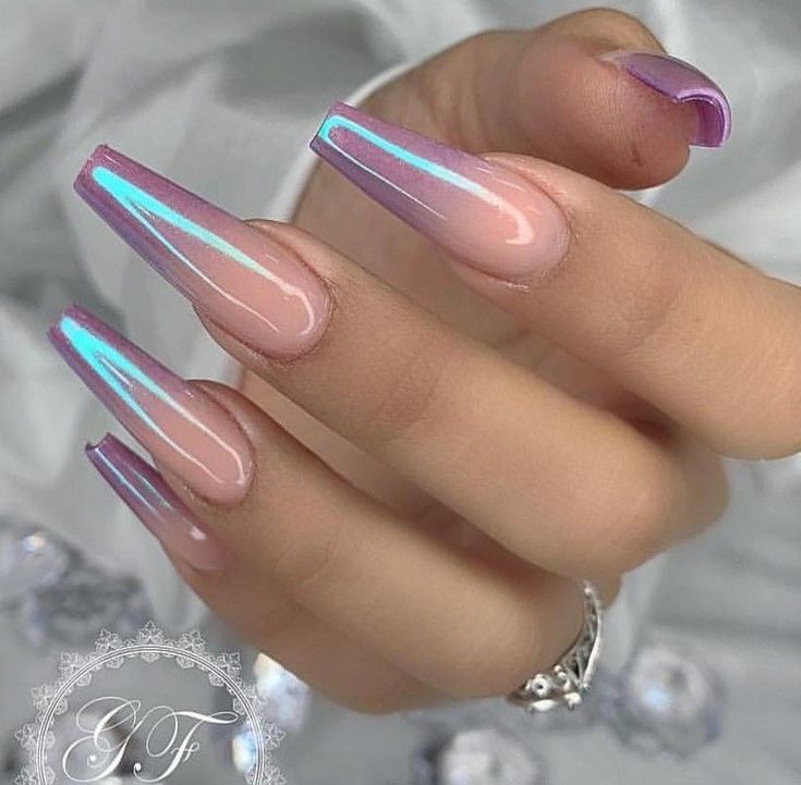 Elegant Gradient Stiletto Nails: Chic Nude and Soft Purple with Iridescent Accents.