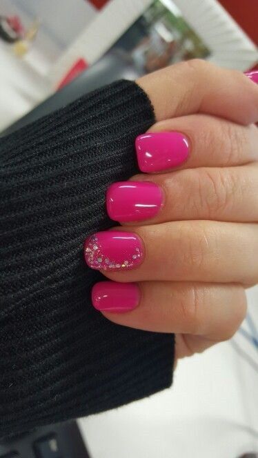 Glossy Vibrant Pink Nail Design with Rhinestone Accent for Chic Elegance.