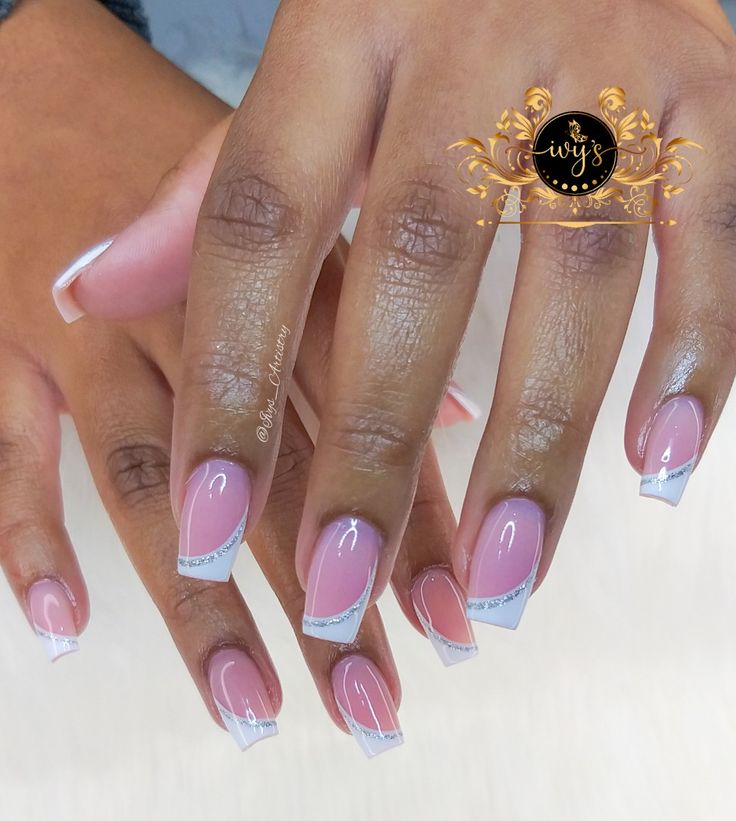 Sophisticated Soft Pink Nail Design with Minimalist White Tips and Sparkling Silver Accents