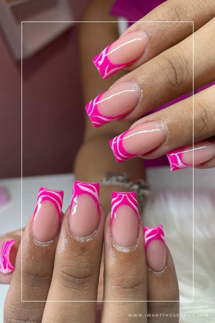 Sophisticated Elegant Pink French Tip Nails with Swirling Designs and Glossy Finish.