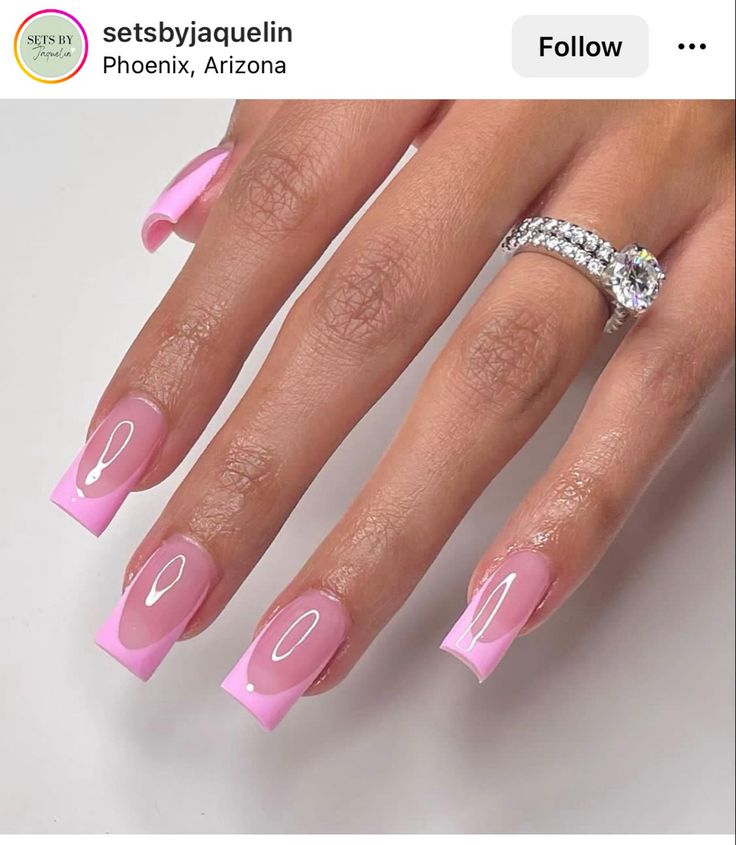 Elegant Pink Nail Design with Glossy Finish and Delicate French Tips for Any Occasion.