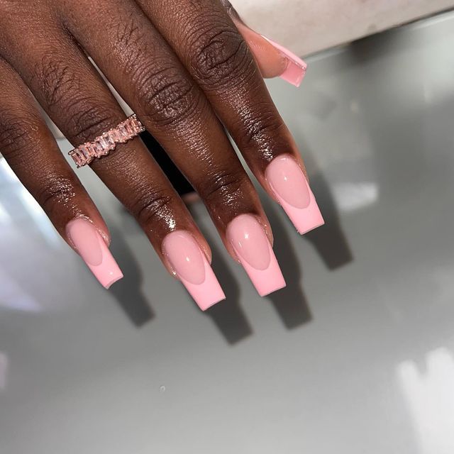 Sophisticated Chic Pink French Tip Nails with Elegant Long Acrylics.