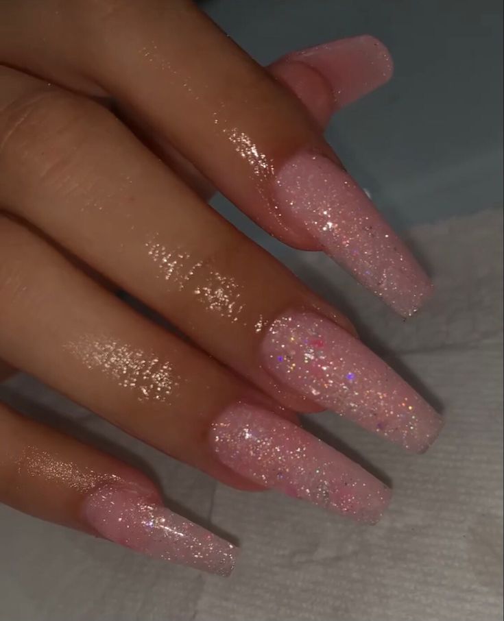 Elegant Sparkling Pink Gradient Nails for a Radiant Look.