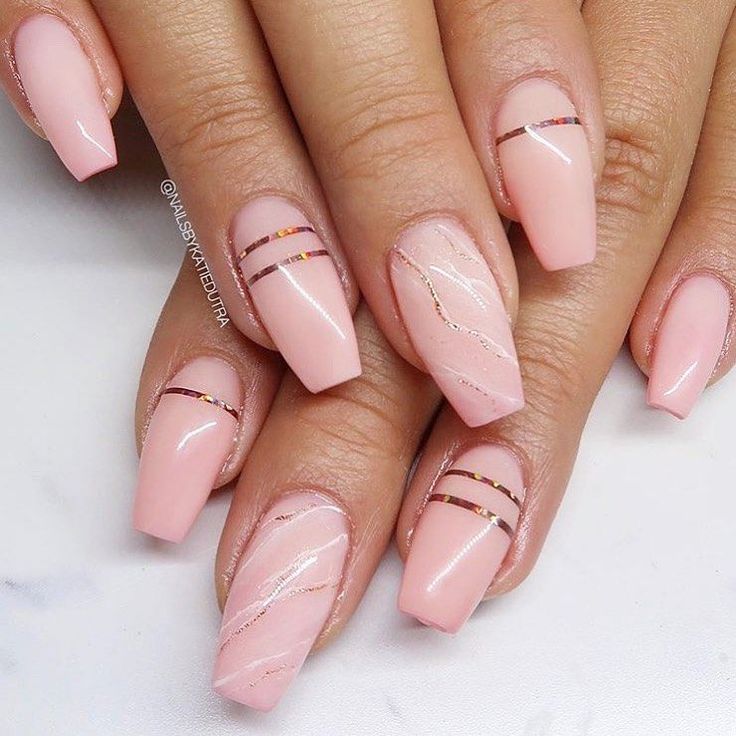 Chic Elegant Nude Nail Design with Soft Pink Base and Metallic Accents.