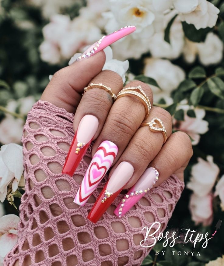 Chic Stiletto Nail Design with Pink and Red Hearts and Sparkling Accents.