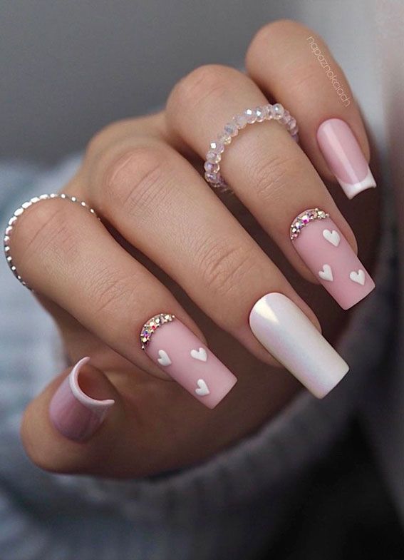 Chic Pink Nail Design with Hearts and Glitter: A Playful Contrast of Matte and Glossy Finishes for Every Occasion.