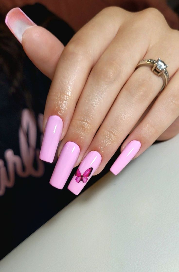 Charming Pink Nails with Glossy Finish and Butterfly Design for a Feminine Touch.