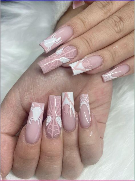 Sophisticated Soft Pink Nail Design with White Spider Motifs and Glitter Accents.