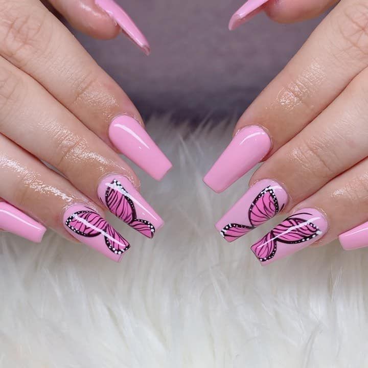 Elegant Soft Pink Nail Design with Intricate Black and Pink Butterfly Art