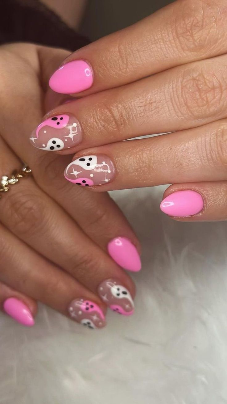 Whimsical Pink Nail Design with Bold Gloss and Playful Patterns