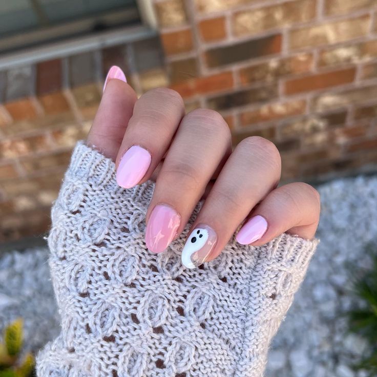 Chic Halloween Nail Design with Soft Pink Palette and Whimsical Ghost Accent