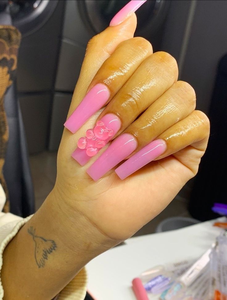 Chic Vibrant Pink Nail Design with Textured Bead Accents