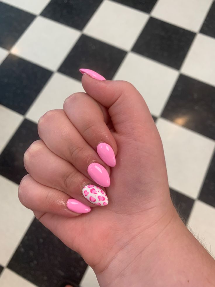 Bold and Playful Vibrant Pink Nails with Whimsical Leopard Print Accent