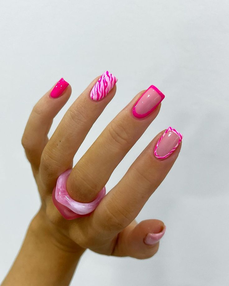 Vibrant Pink Nail Design: Chic Almond Shape with Textured Patterns and Glossy Finishes.