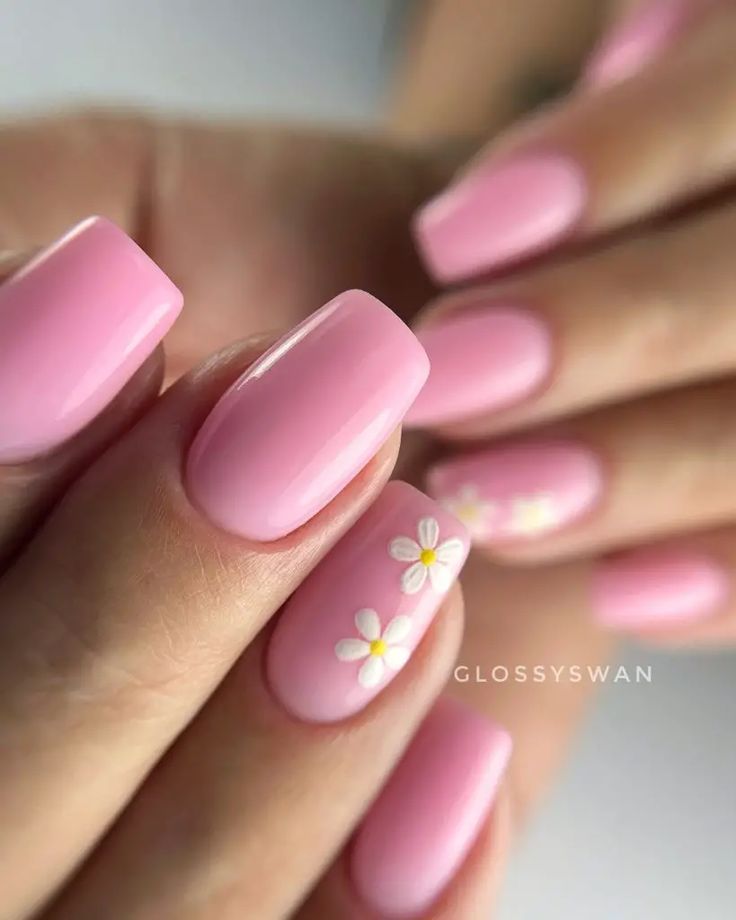 Trendy Glossy Pink Nail Design with Custom Floral Accents for Elegant Occasions