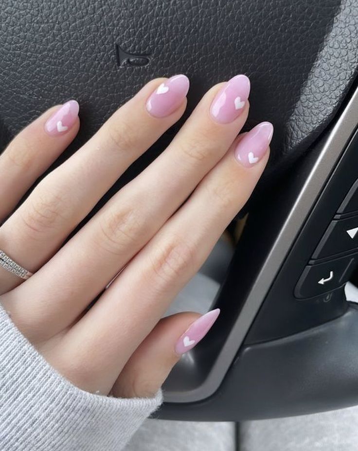 Chic Pink Nail Design with Heart Accents: A Playful Expression of Affection.