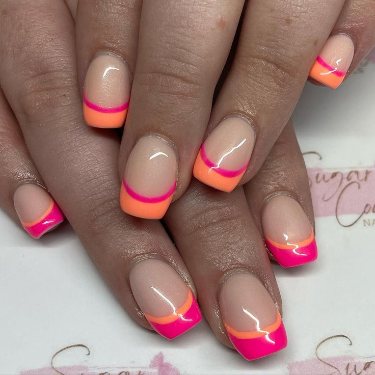 Playful Neon Pink and Orange French Tip Nail Design with Glossy Elegance.