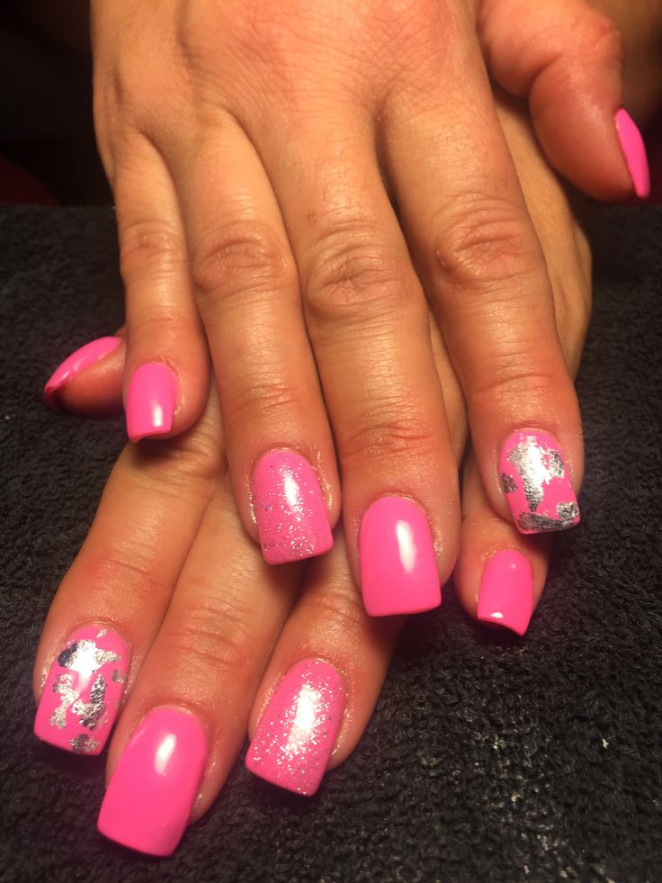 Chic Pink Manicure with Glossy and Glitter Finishes and Shimmering Silver Accents.