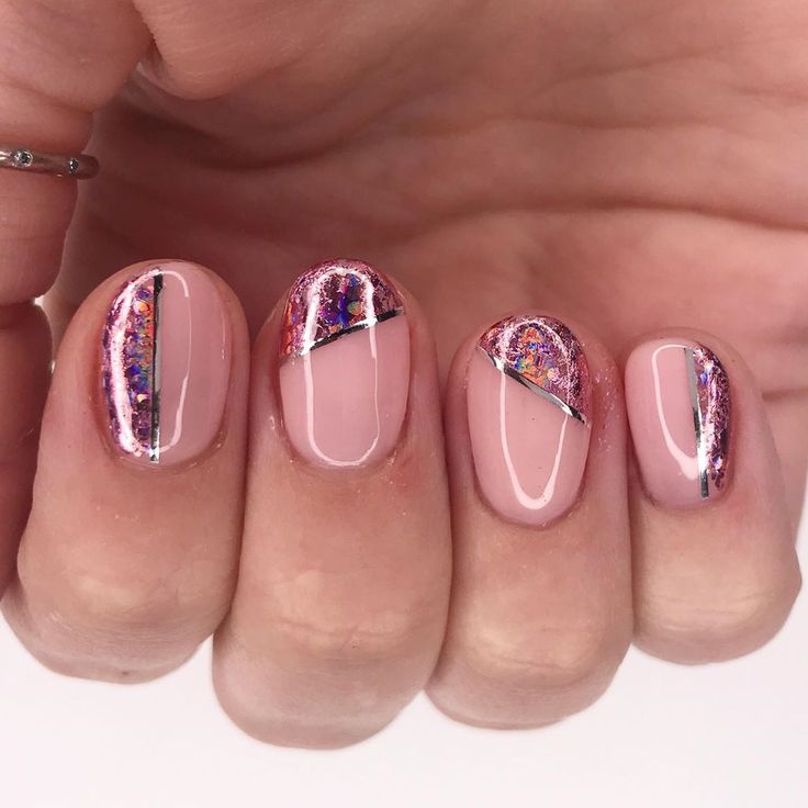 Elegant Soft Pink Nail Design with Holographic Accents and Silver Geometric Foil.