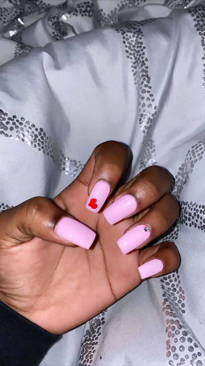 Elegant Chic Pink Nails with Playful Accents of Red Heart and Gem