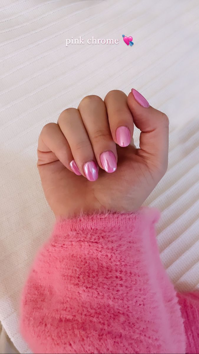 Chic Pink Chrome Nails: A Glossy Blend for a Playful Look.