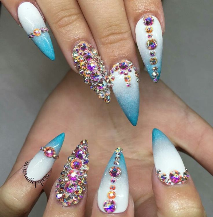 Glamorous Almond-Shaped Nail Design: Gradient White and Soft Blue with Sparkling Rhinestones.