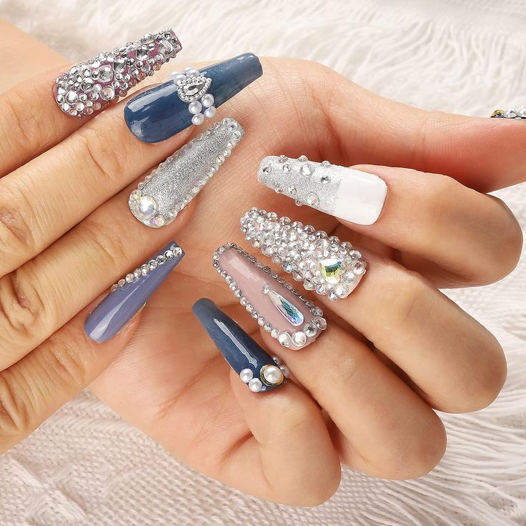 Luxurious Sparkly Nail Design with Elegant Shades and Dazzling Embellishments.