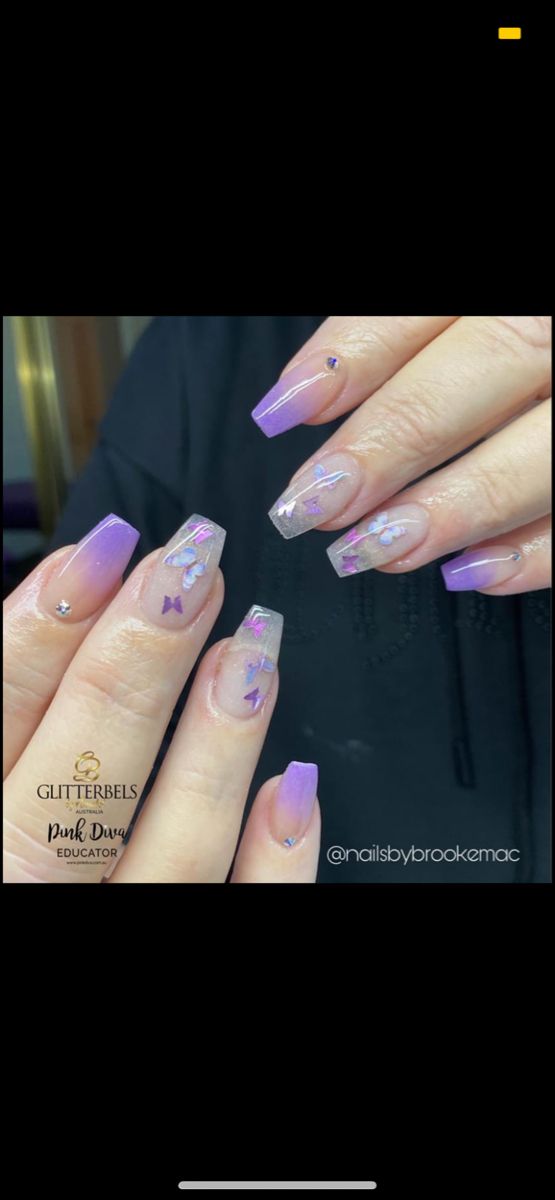 Charming Gradient Purple Nail Design with Floral Embellishments and Sparkling Accents