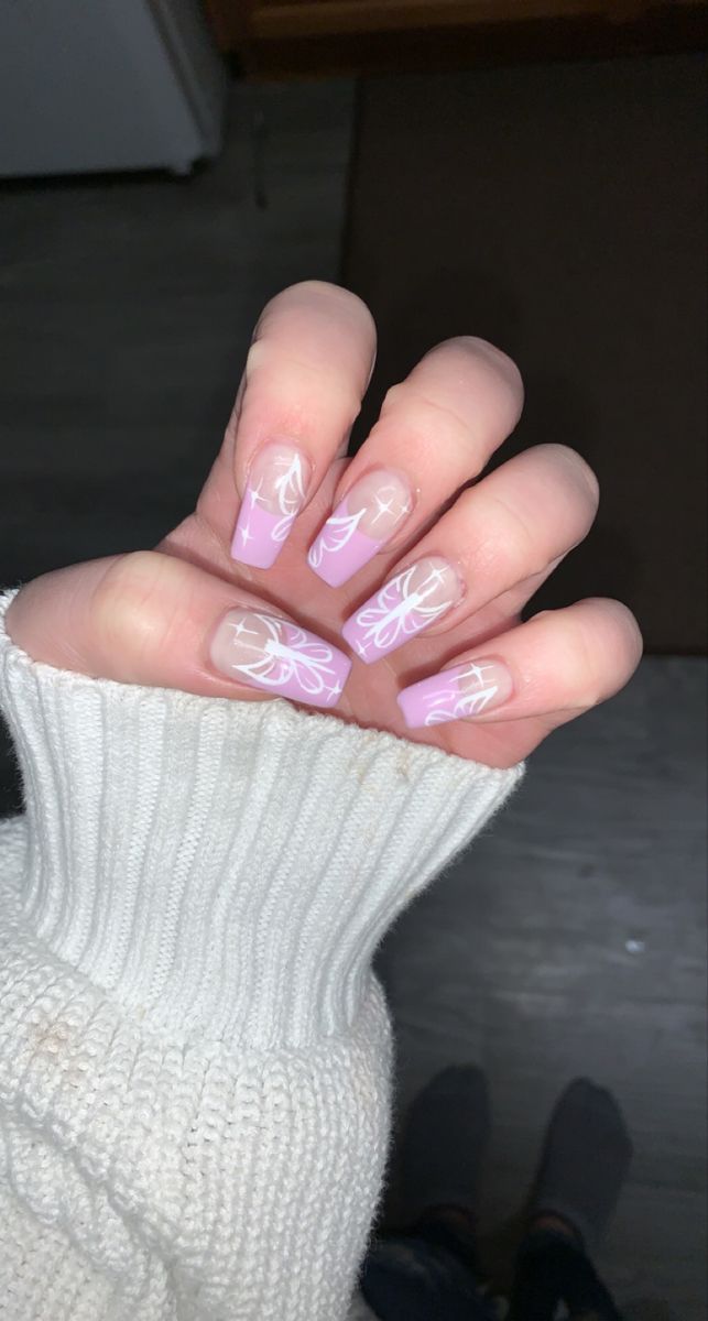 Elegant Lavender Nail Design with Delicate Floral Patterns for Trendy Sophistication.