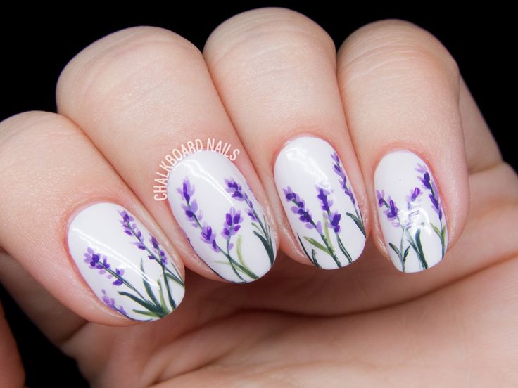 Elegant Lavender-Themed Nail Design Featuring Delicate Floral Details on a Crisp White Base.