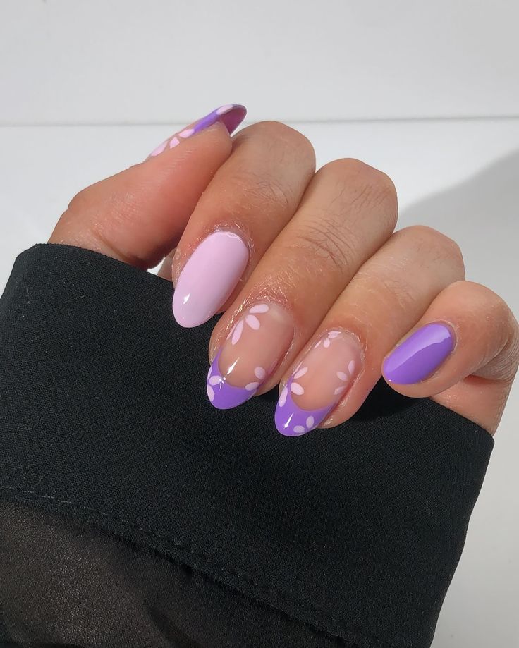 Pastel Pink and Lavender Nail Design with Delicate Floral Motifs for a Playful Spring Vibe