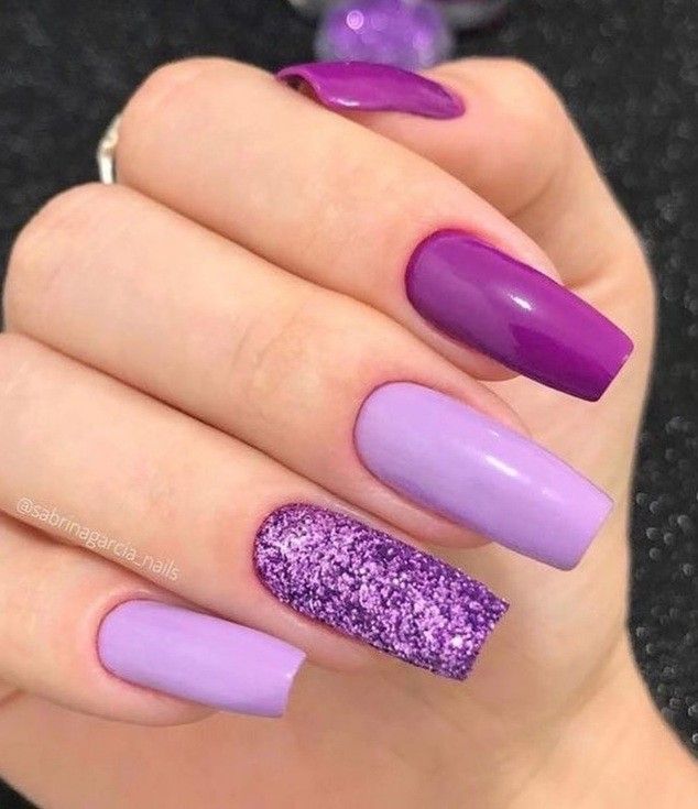 Chic Purple Nail Design with Glossy Finishes and Textured Glitter Accents.